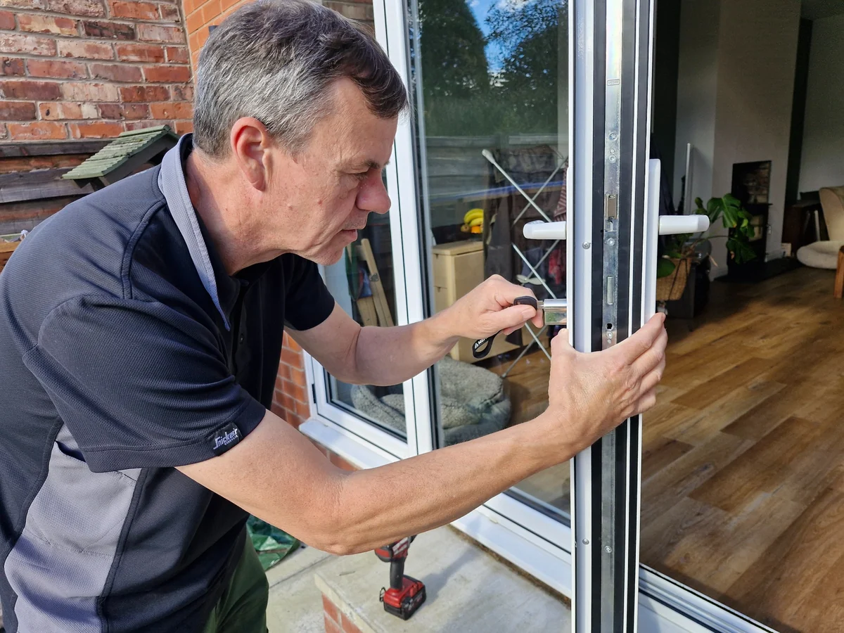 James fitting a 3-star anti-snap cylinder to a uPVC door in Sale